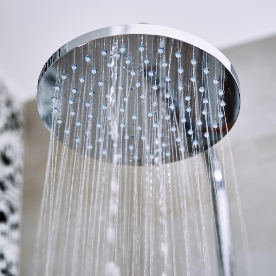 water-flowing-from-shower-head-in-bathroom-2023-11-27-04-49-17-utc